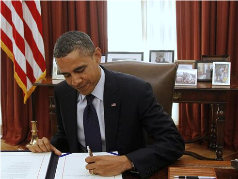 Obama-signing - Obama Signing Bills Clipart (1100x384), Png Download