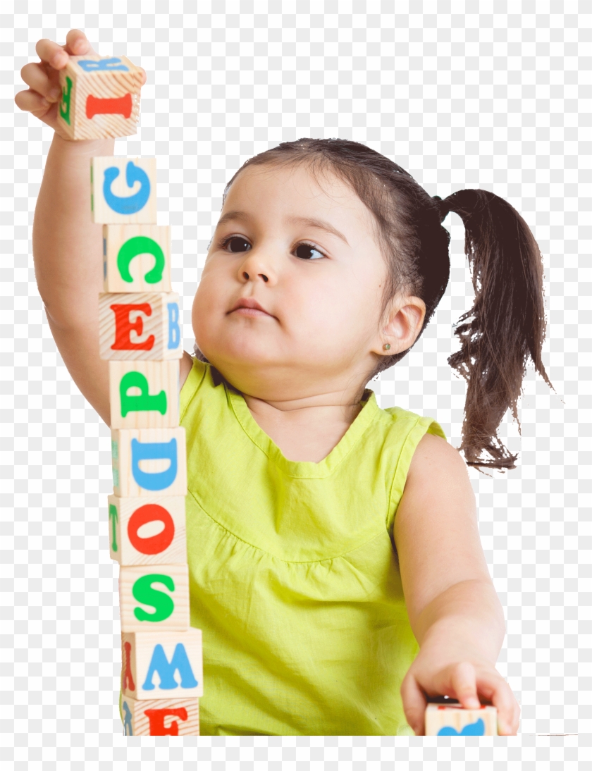 child stacking blocks
