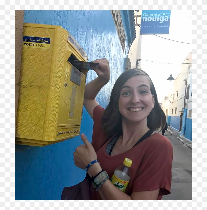 Woman Placing Mail In A Mailbox While Looking At The - Girl Clipart