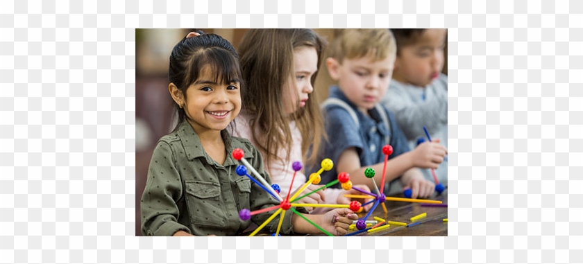Four Small Children Playing With Interlocking Toys - Preschool Clipart
